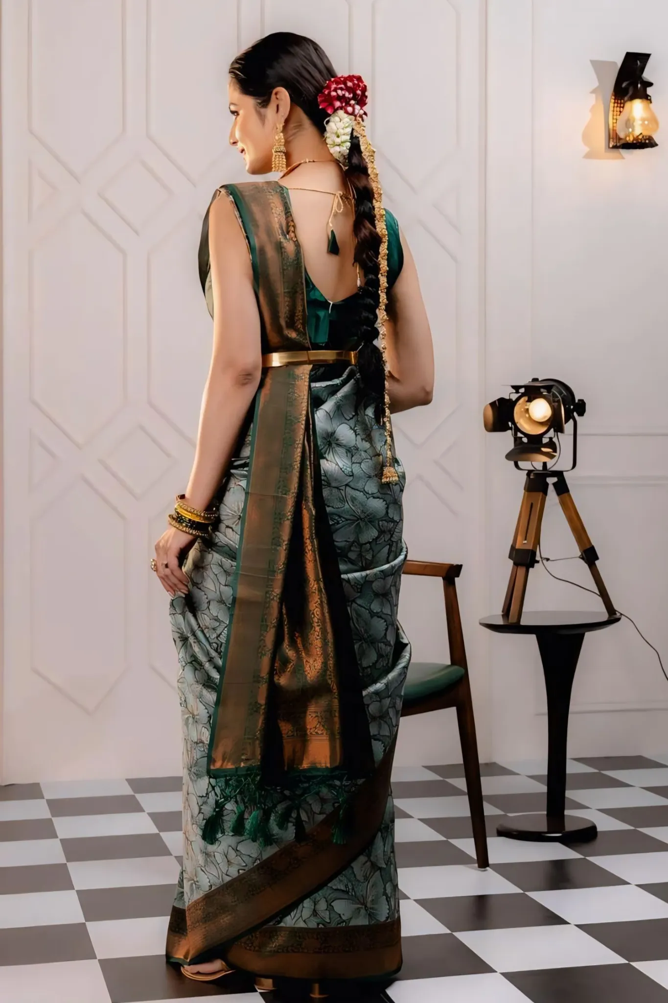 THE SAREE SHOWCASES A DELICATE INTERPLAY OF COLORS AND PATTERNS