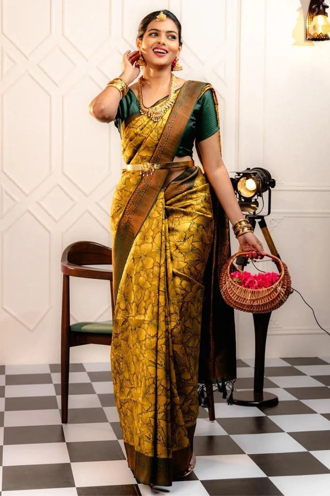 THE SAREE SHOWCASES A DELICATE INTERPLAY OF COLORS AND PATTERNS
