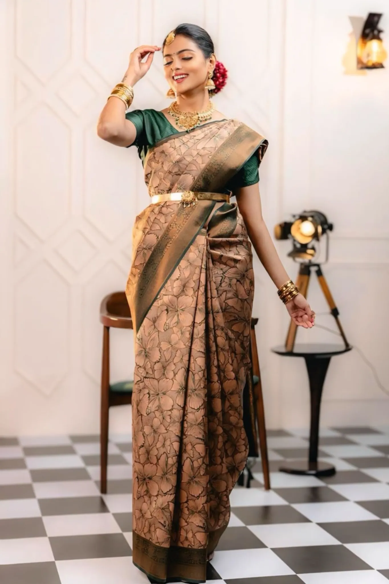THE SAREE SHOWCASES A DELICATE INTERPLAY OF COLORS AND PATTERNS