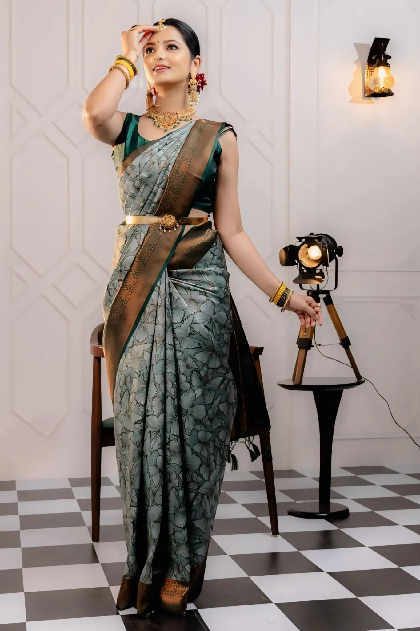 THE SAREE SHOWCASES A DELICATE INTERPLAY OF COLORS AND PATTERNS
