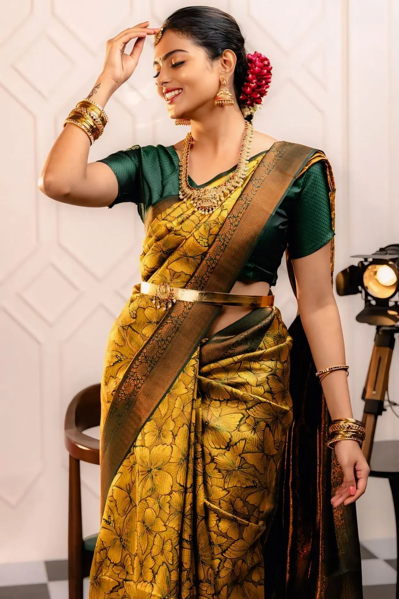 THE SAREE SHOWCASES A DELICATE INTERPLAY OF COLORS AND PATTERNS