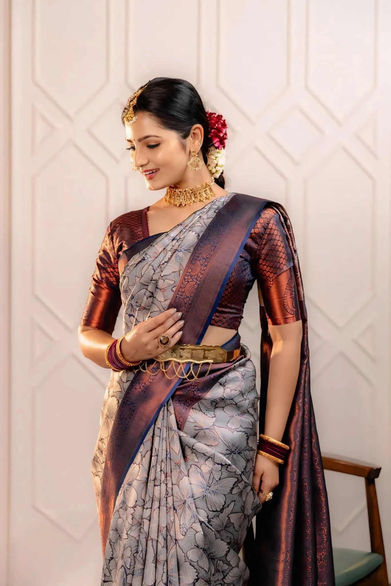 THE SAREE SHOWCASES A DELICATE INTERPLAY OF COLORS AND PATTERNS
