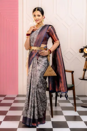 THE SAREE SHOWCASES A DELICATE INTERPLAY OF COLORS AND PATTERNS