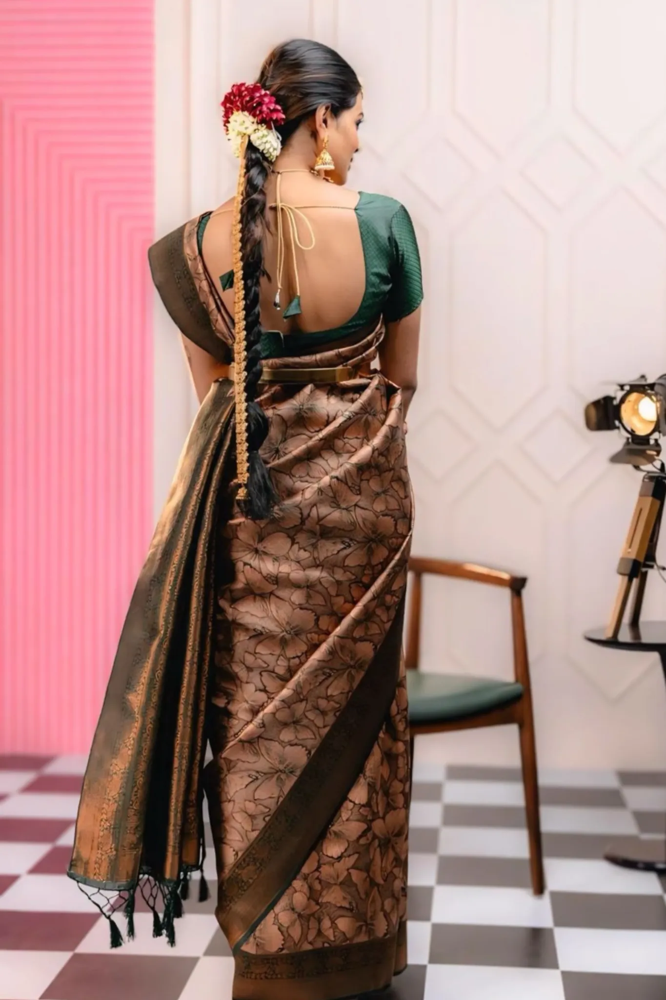 THE SAREE SHOWCASES A DELICATE INTERPLAY OF COLORS AND PATTERNS