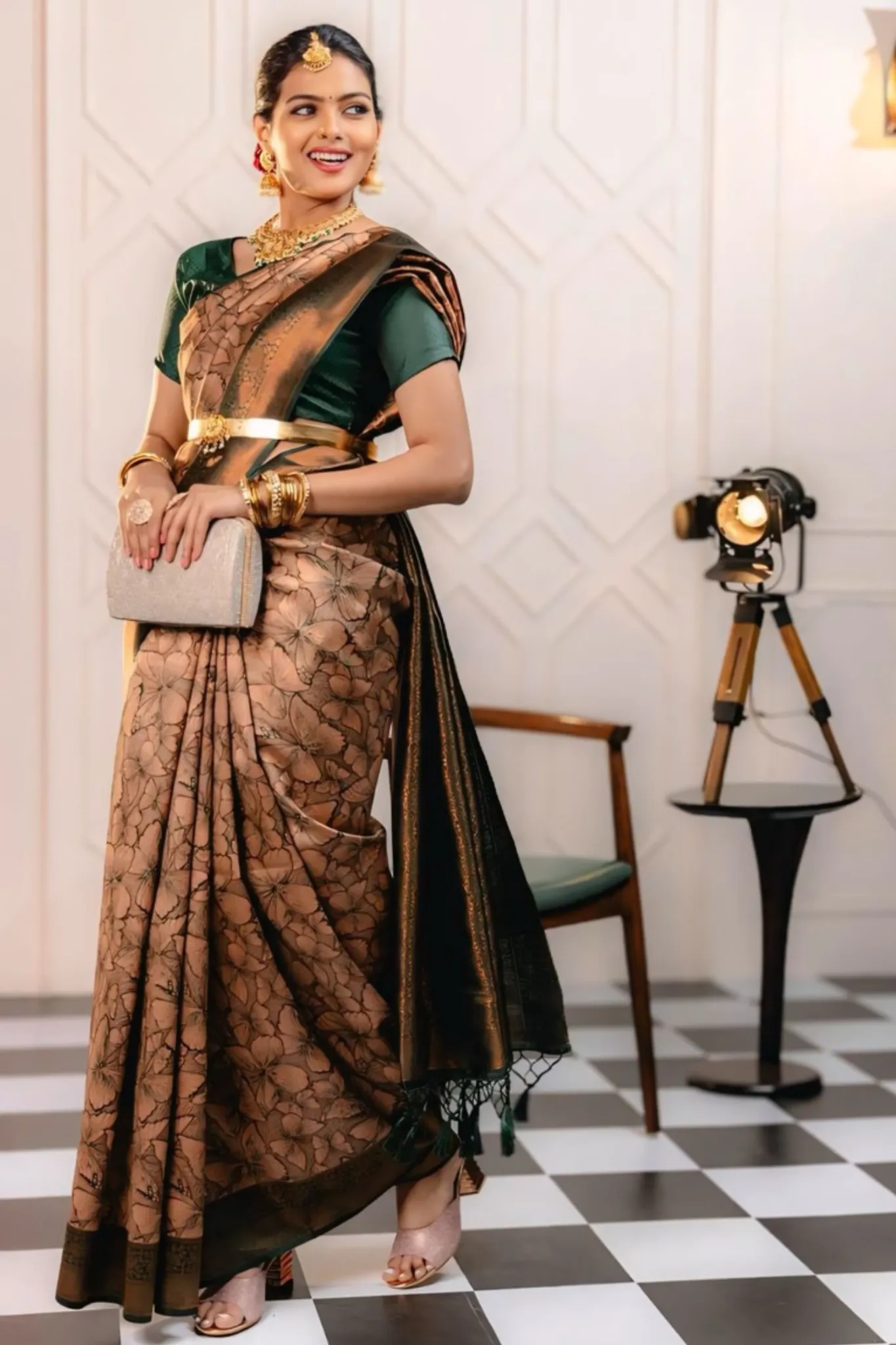 THE SAREE SHOWCASES A DELICATE INTERPLAY OF COLORS AND PATTERNS
